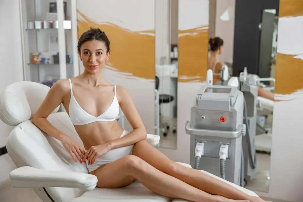 Cheerful young woman with smooth skin ready for laser skin treatment RDYMD FACILITY